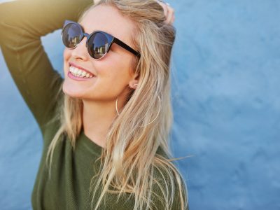 Happy woman wearing sunglasses